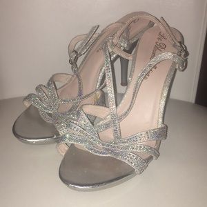 Silver open toe size 8.5 heels.